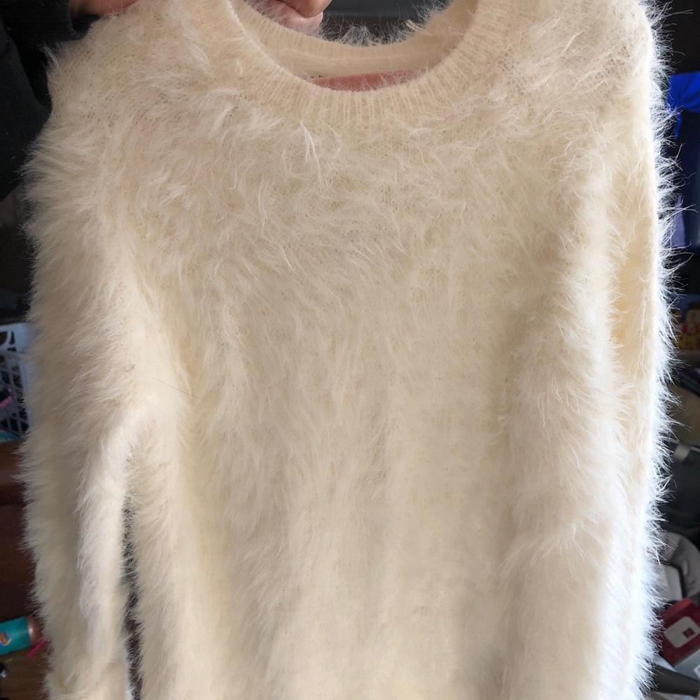 white fuzzy sweater